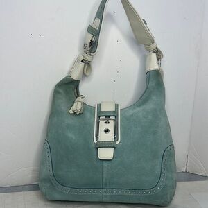 Coach Hamilton Hobo leather handbag
In pastel blue suede